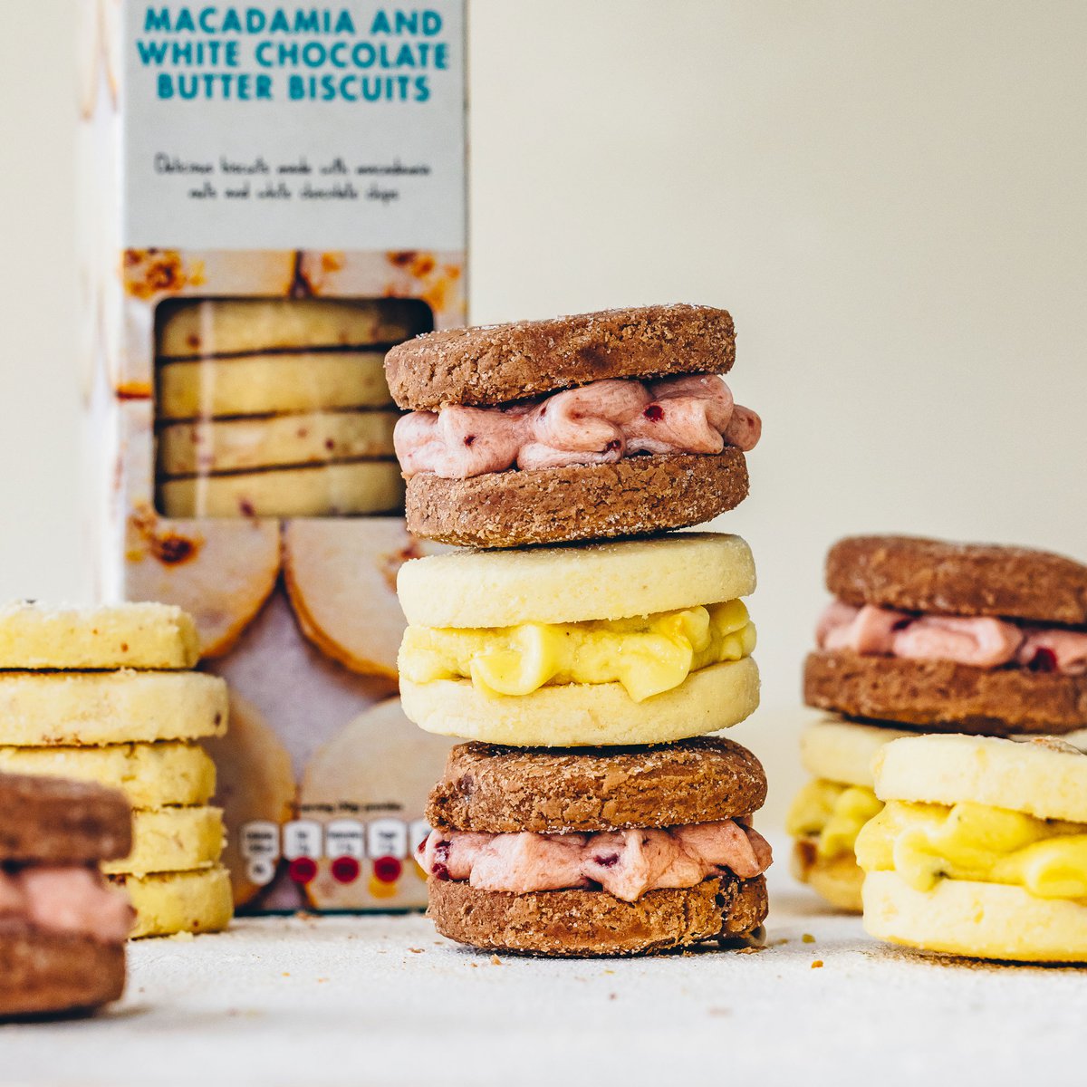 Melting moments with passionfruit and raspberry jam icing