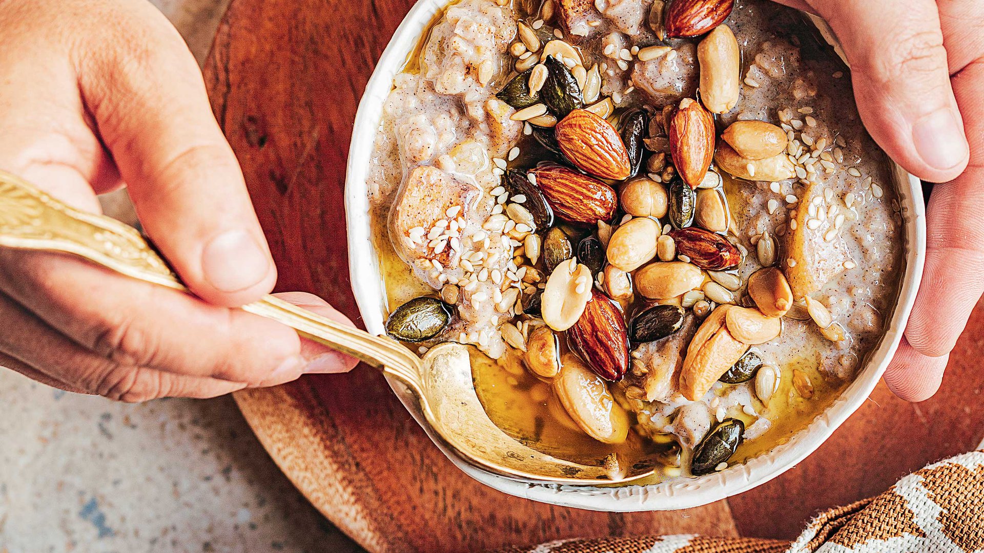 Apple pie porridge with ghee-toasted nuts
