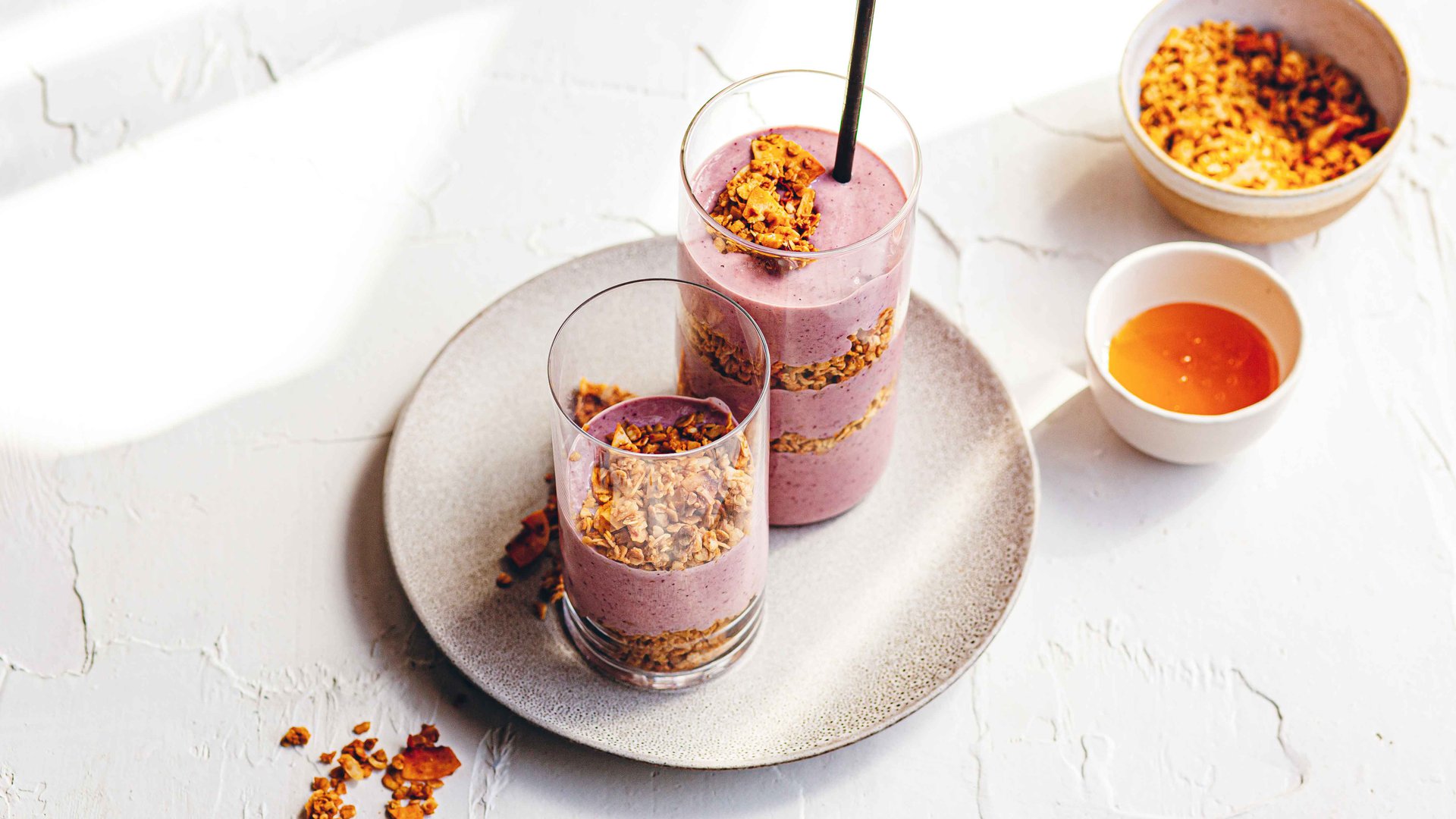 Berry oat smoothie with coconut granola