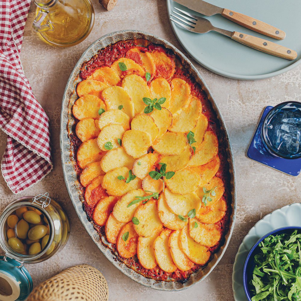 Cheesy baked polenta in tomato and roasted pepper sauce