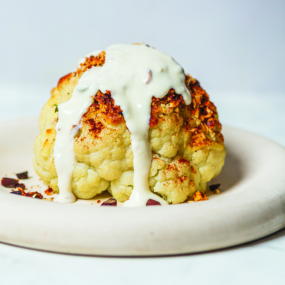 Cheesy roast cauliflower with crunchy almond topping