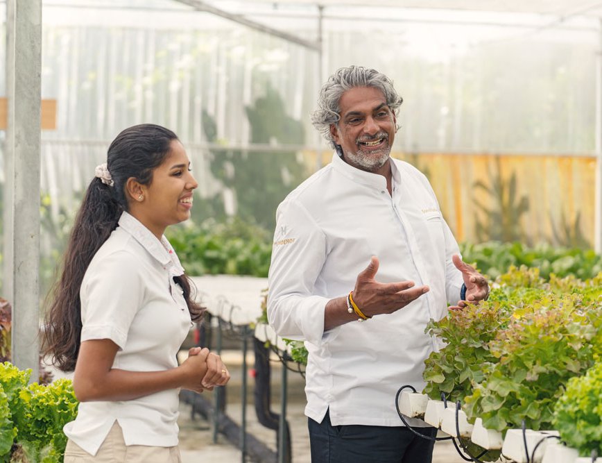 Chef Soenil Bahadoer touring the resort’s greenhouse