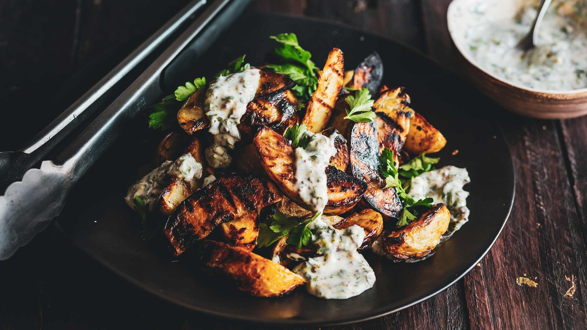 Garlic grilled potato wedges with herby sauce