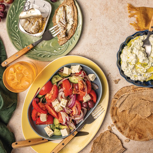 Greek salad with smoked sardines, tzatziki and pita bread