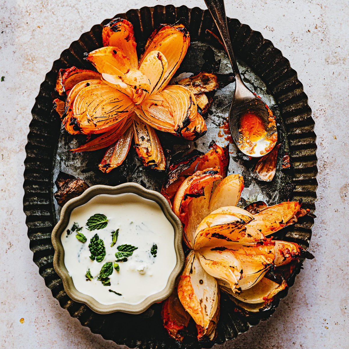 Grilled blooming onion with harissa