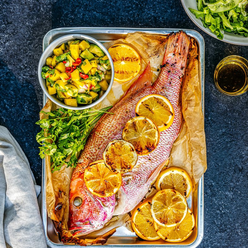 Grilled fish with mango salsa and mixed green salad