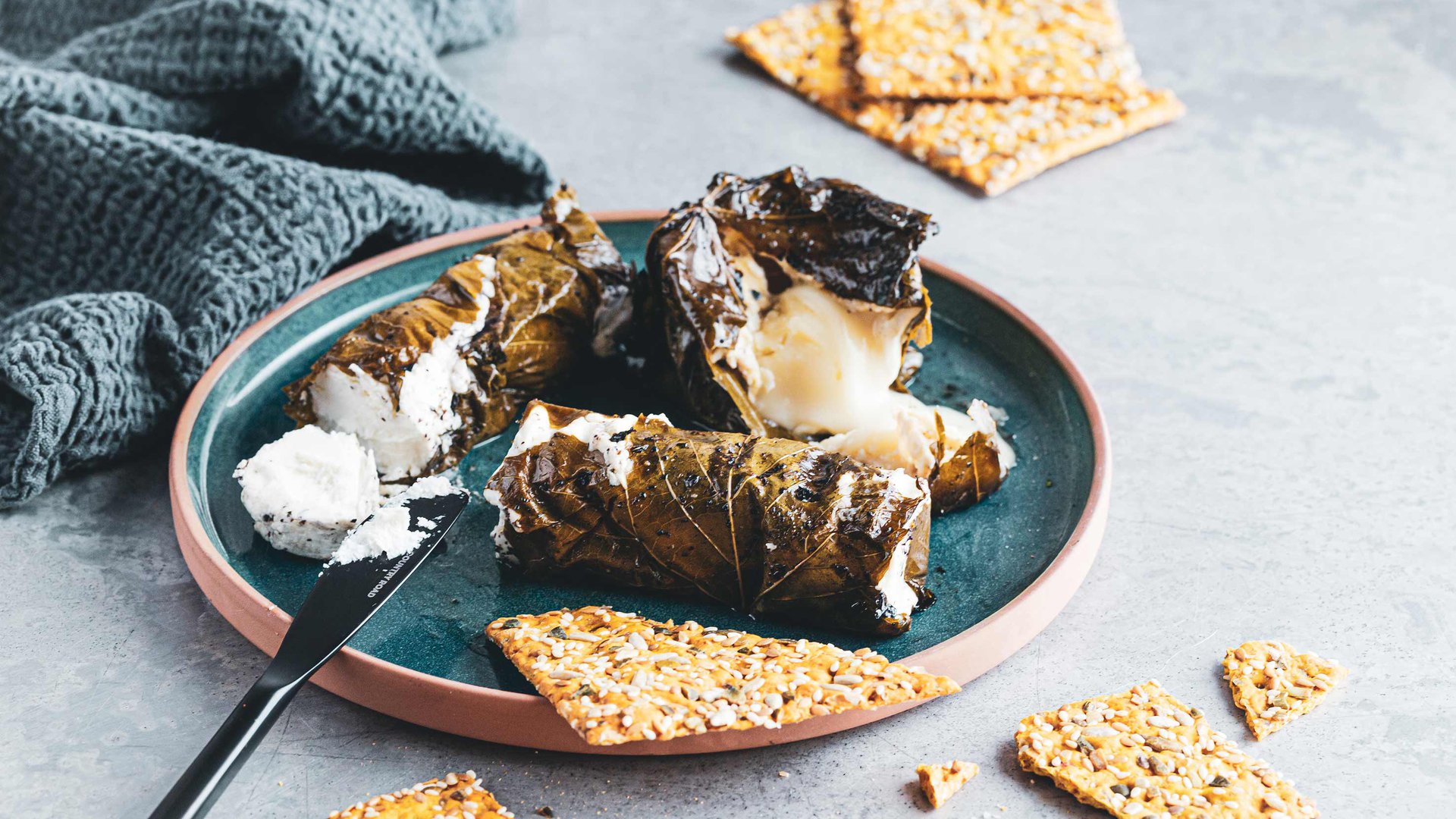 Grilled sumac and mint marinated vine leaf wrapped goat’s cheese