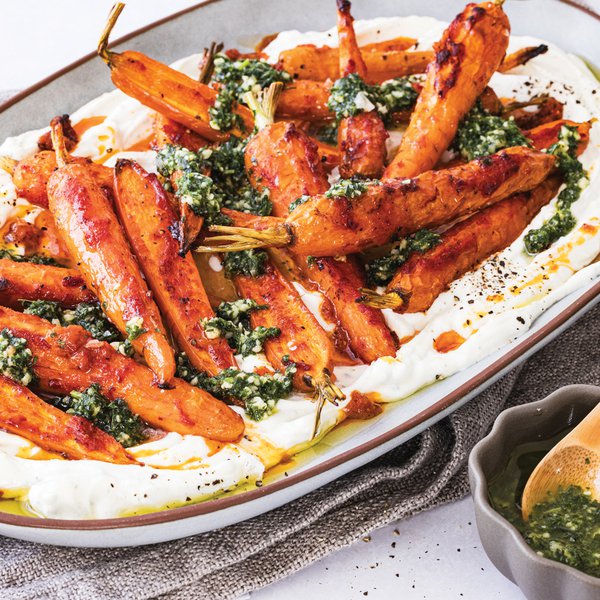 Harissa-roasted carrots with labneh and carrot top-coriander pesto