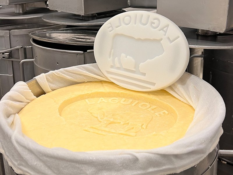 The picturesque village of Rocamadour sits on a cliff | Cyprian Duroux is a fourth-generation cheesemaker | Laguiole is a pressed, uncooked cheese that has been made since the 12th century | Alpine goats at La Borie d’Imbert, a farm renowed for making Rocamadour | Alain Guittard handcrafts Saint-Nectaire cheese | Rinds are washed by hand at Mons Cheese