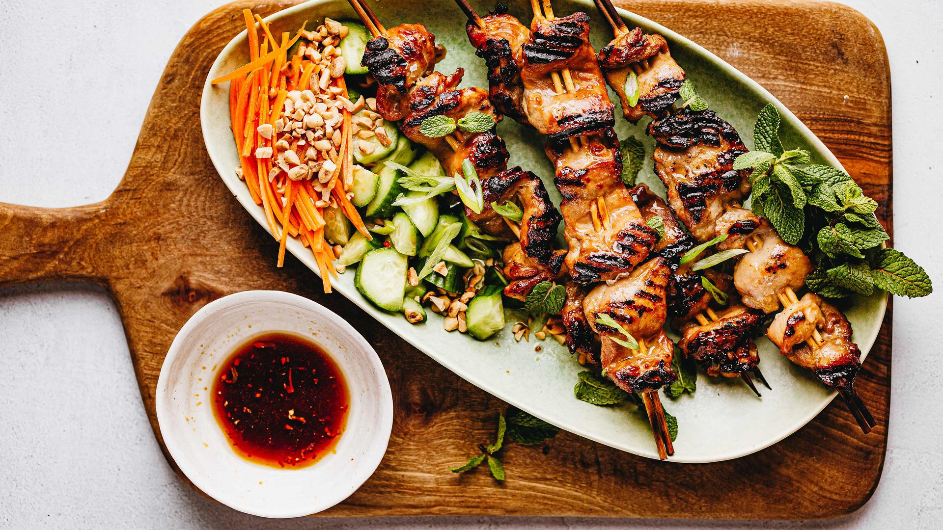 Indonesian chicken satay with roasted chilli peanut salad