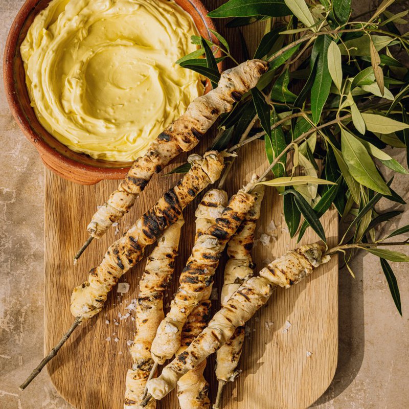 Whipped olive oil dip with green olive breadsticks
