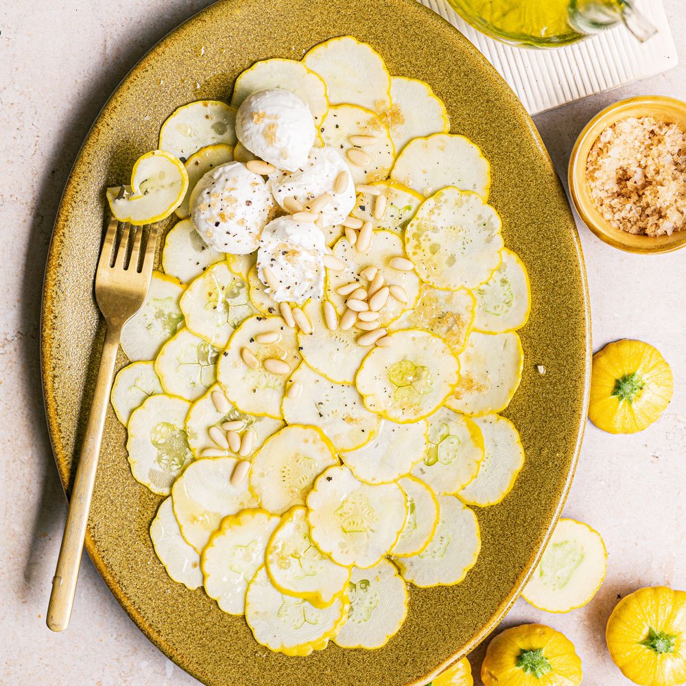 Patty pan carpaccio with burrata and Worcestershire salt