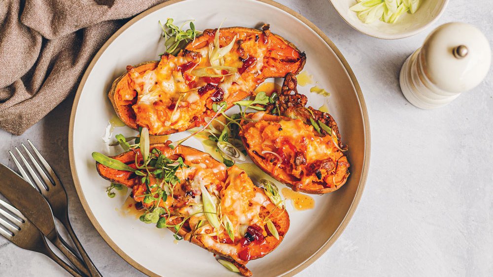 Peppadew and cream cheese loaded sweet potatoes with microgreens