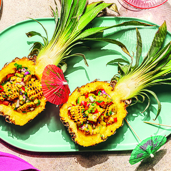 Pineapple and corn salad in pineapple halves