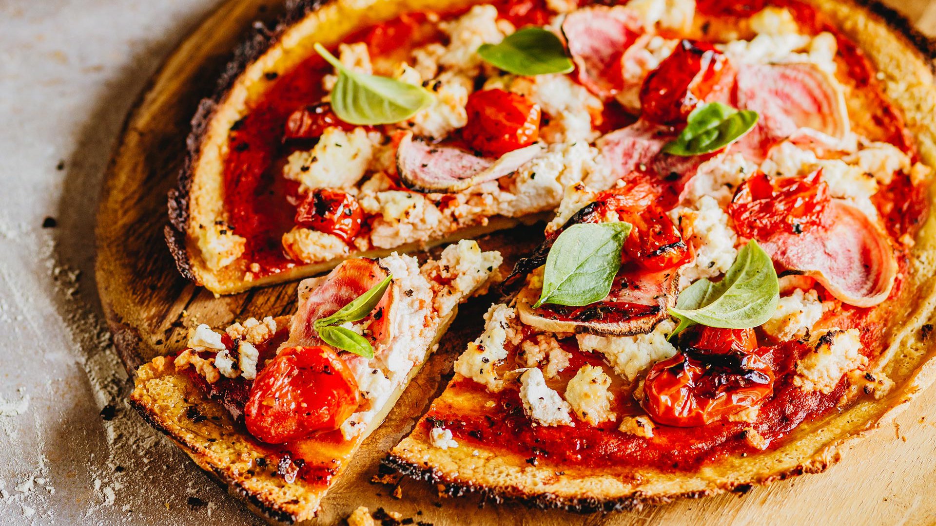 Beetroot, ricotta and baby tomato pizza with basil