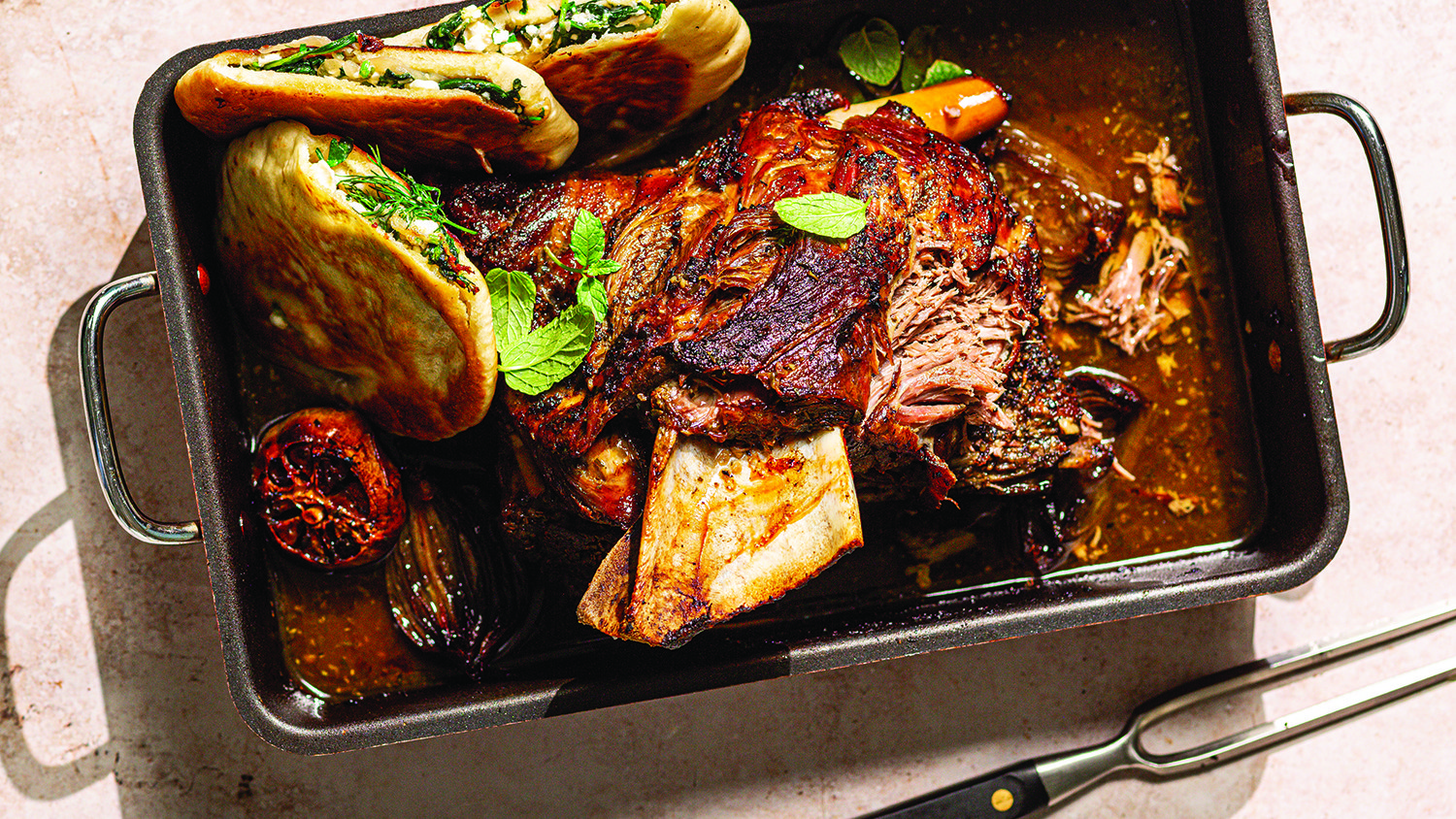 Pulled lamb shoulder with grilled spanakopita flatbreads