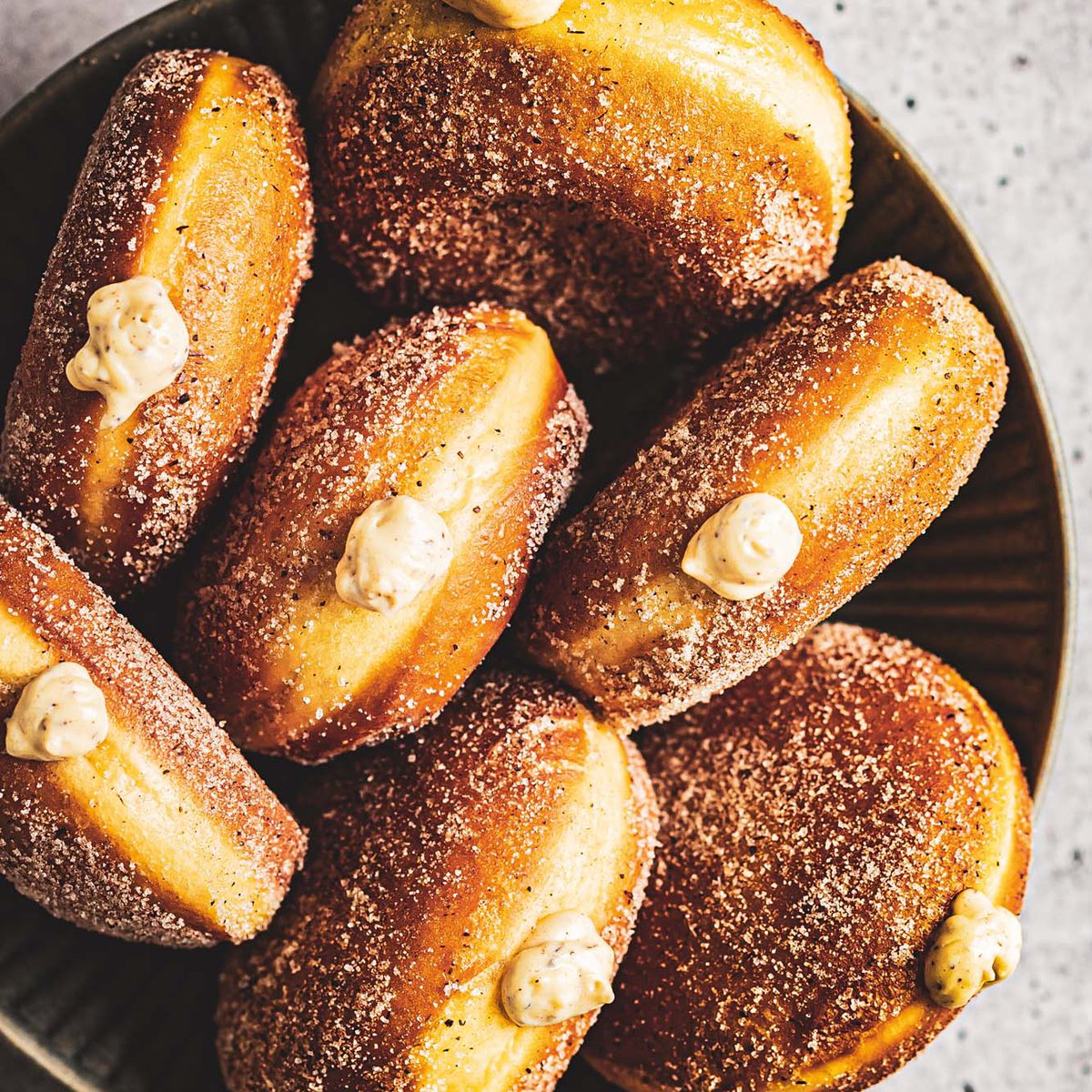 Pumpkin-spiced bomboloni with cinnamon custard