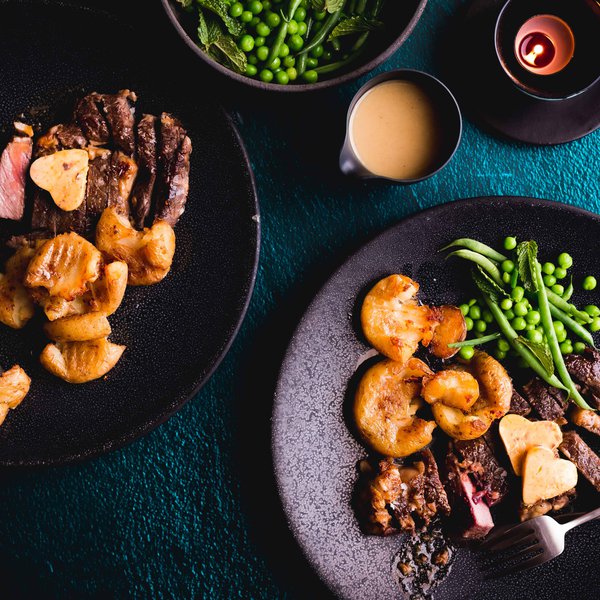 Rib-eye steak with anchovy butter and crispy roast potatoes