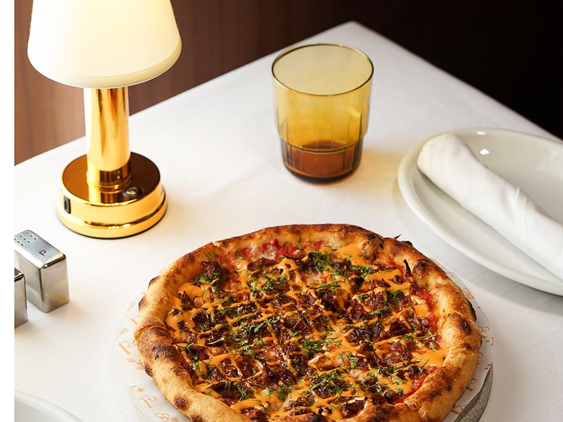 Aarancini nigiri with wagyu and caviar │ The interiors of the restaurant are classically designed │ Spicy duck and Sriracha pizza │ Burrata with pomegranate, datterini tomatoes and frozen tomato