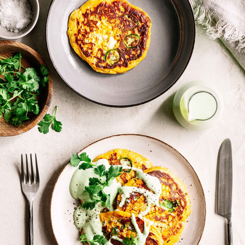 Savoury sour milk corn cakes with green chilli and lime