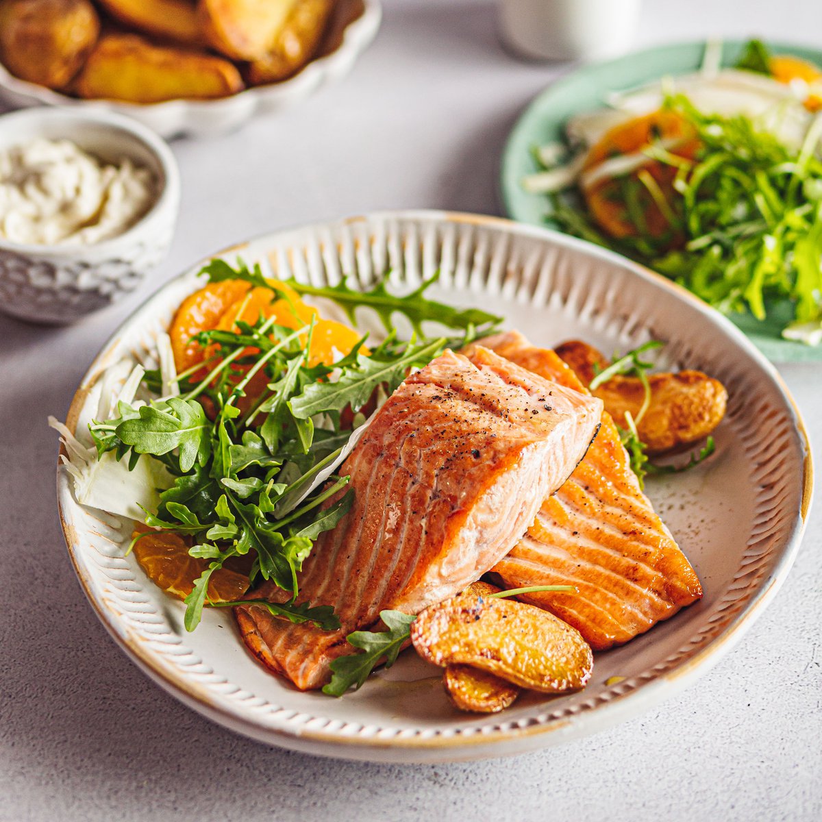 Seared Scottish salmon with roasted potatoes and a rocket, orange and fennel salad
