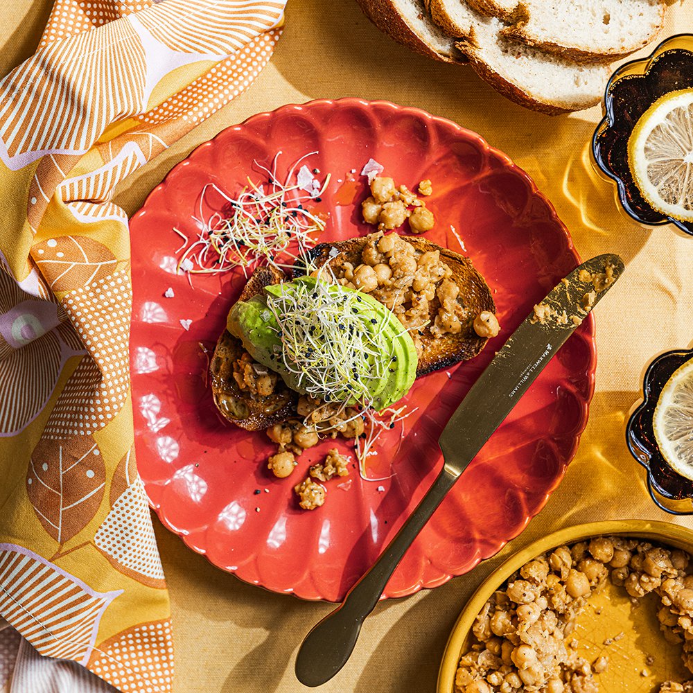 Smashed miso chickpeas and avocado on rye toast