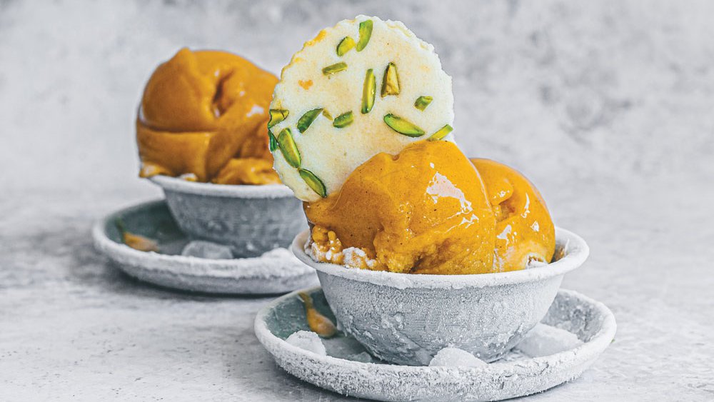 Spiced mango sorbet with pistachio tuiles
