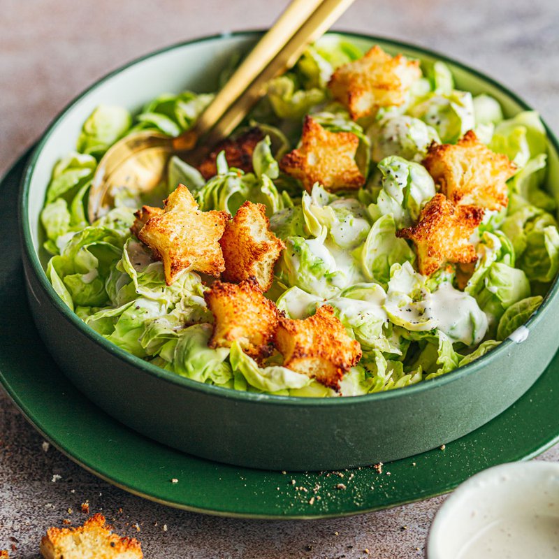 Brussels sprouts salad with crispy croutons and anchovy dressing