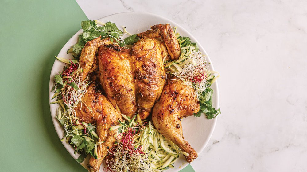Roast laksa chicken and courgette sprout salad