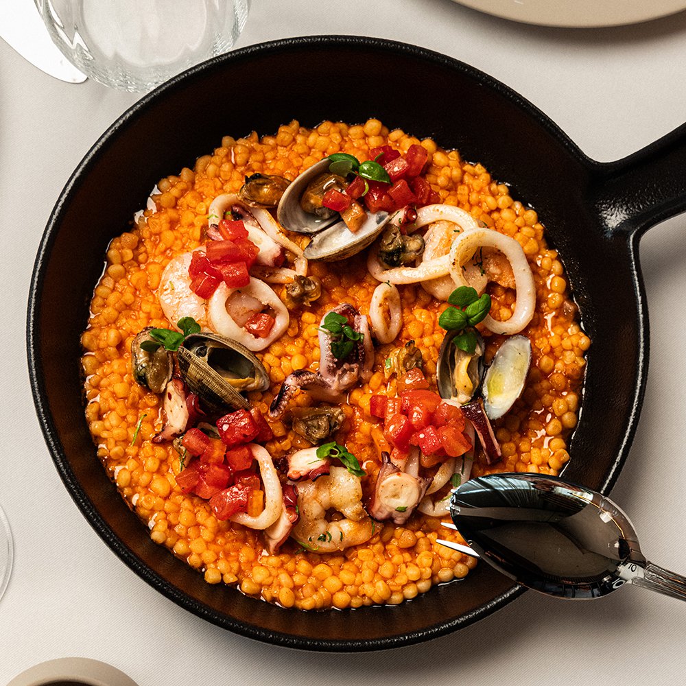 TOTÓ’s traditional Sardinian fregola pasta with mussels, clams, prawns and calamari