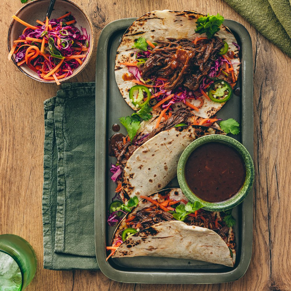 Chipotle miso pulled beef tacos with kombucha carrot slaw