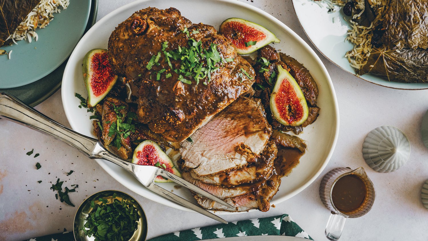 Cinnamon and fig roasted lamb leg with a giant dolma