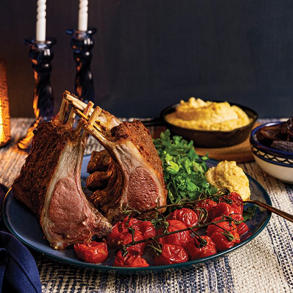 Cumin-crusted lamb rack with roasted tomatoes and baked hummus