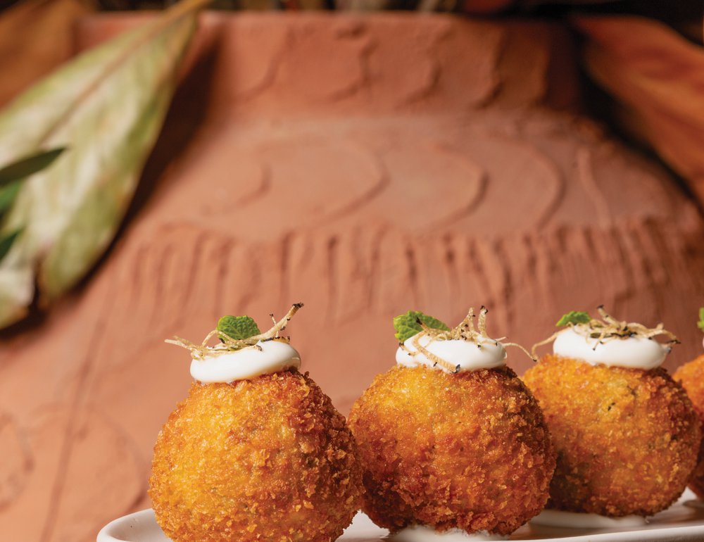 Hot appetisers at Iliana include courgette fritters with yoghurt honey, truffle and mint oil