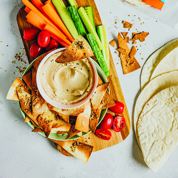 Everything bagel wrap chips with hummus and crudités