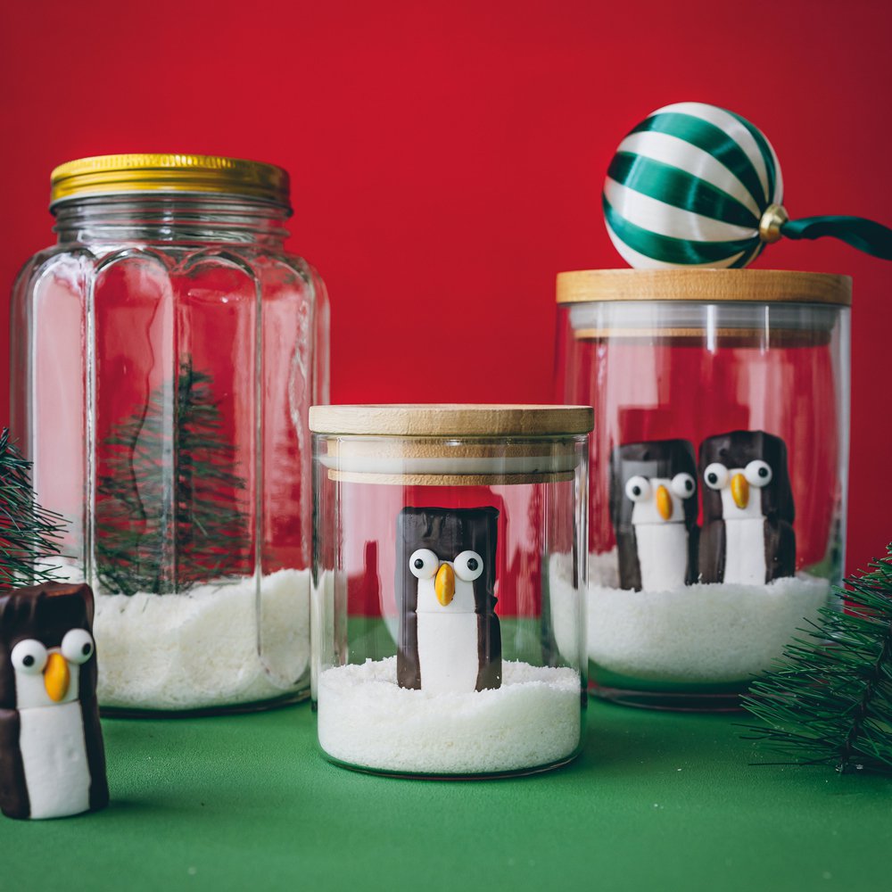 Festive snow globe jars with marshmallow penguins