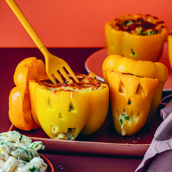 Jack-o-lantern mac and cheese stuffed capsicums