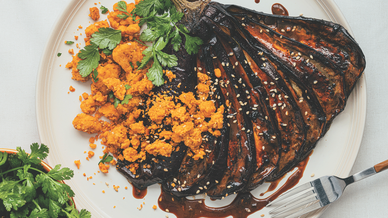 Miso-roasted aubergine steaks with gochujang crumble