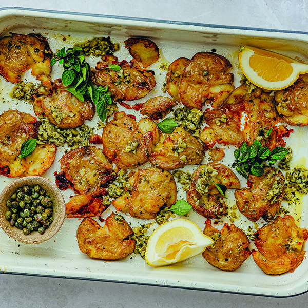 Smashed roasted baby potatoes with green olive and caper butter