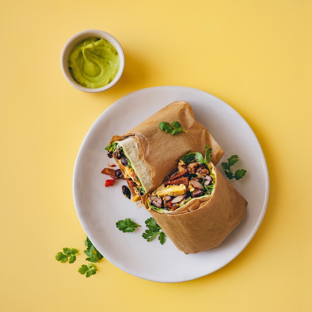 Smoky breakfast burrito with avocado crema