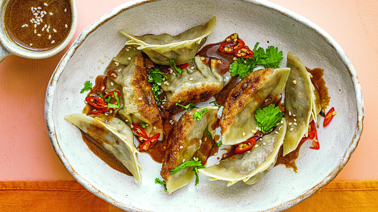 Tempeh-shiitake dumplings with black garlic dipping sauce