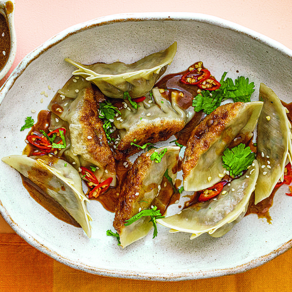 Tempeh-shiitake dumplings with black garlic dipping sauce