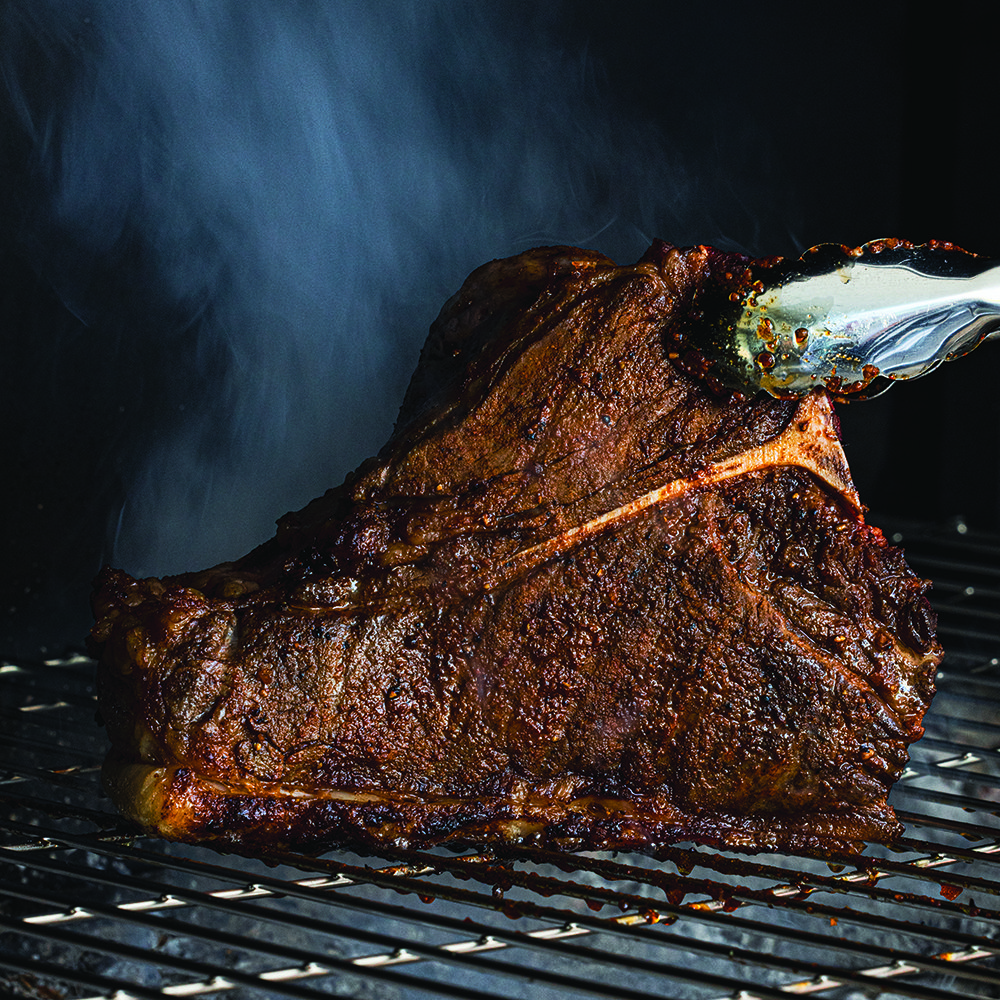 Texas salt ‘n’ pepper crusted grilled tomahawk steak