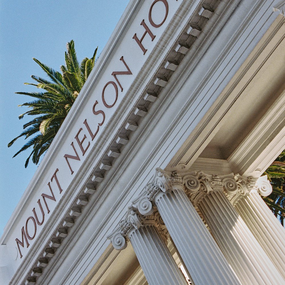 Neoclassical columns marking the grand entrance; afternoon tea delights by pastry chef Vicky Gurovich