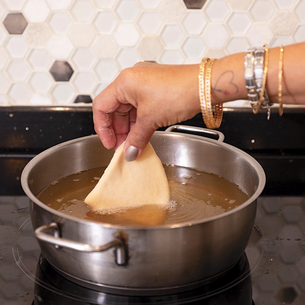 Frying mandazi