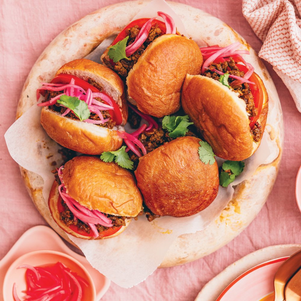 Vetkoek and curried mince with pickled red onion