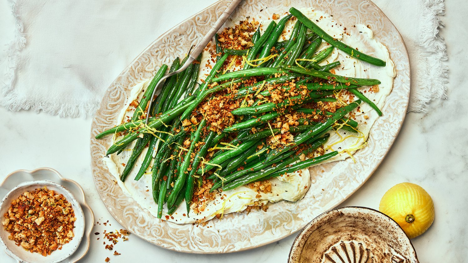 Whipped goat’s cheese with garlic green beans and herby pangrattato