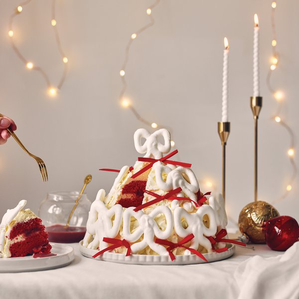 White chocolate and cherry curd cake with meringue bows