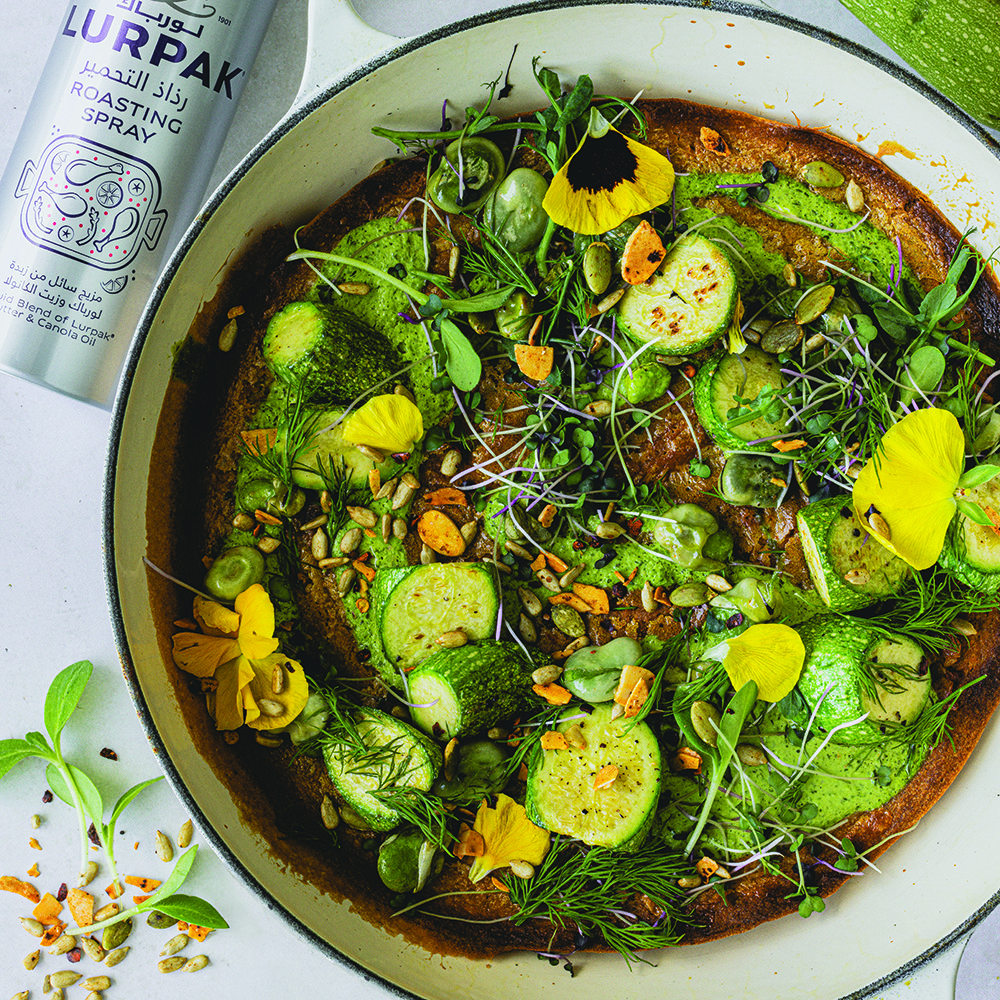 Spring vegetables topped chickpea socca with green goddess dressing