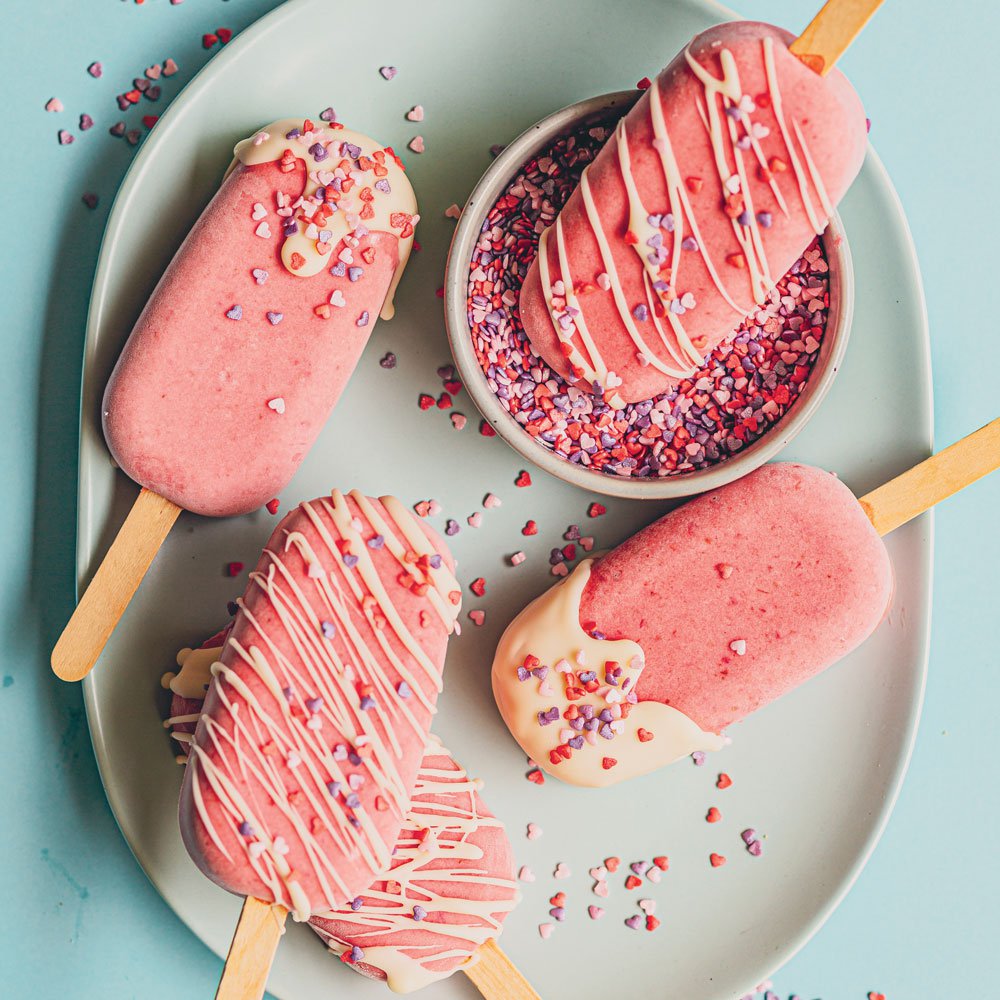 Strawberry milk popsicles with sprinkles